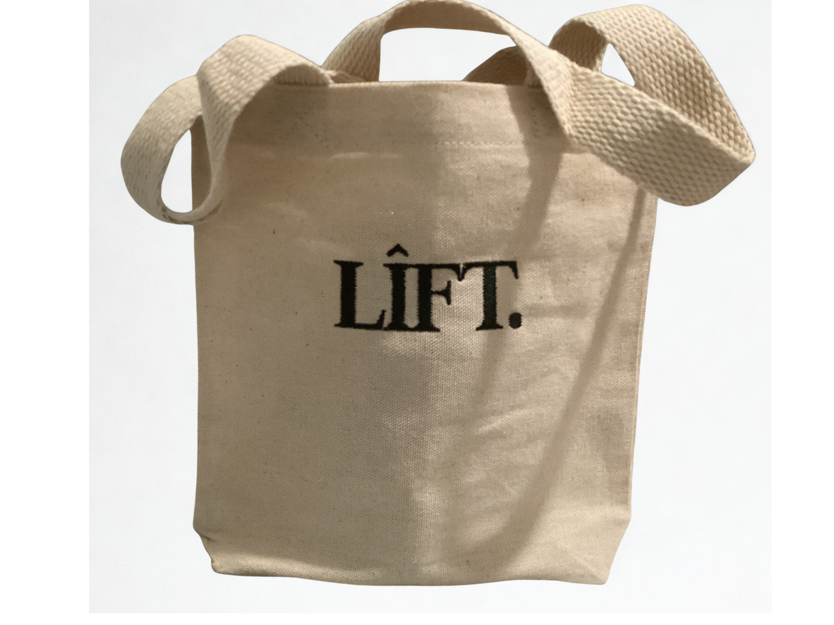 Example of embroidered LOGO.

A natural canvas tote bag with black embroidered text reading 'LIFT.' on the front, shown against a plain white background.

8"W x 8"H x 1.5"D
14" Handles